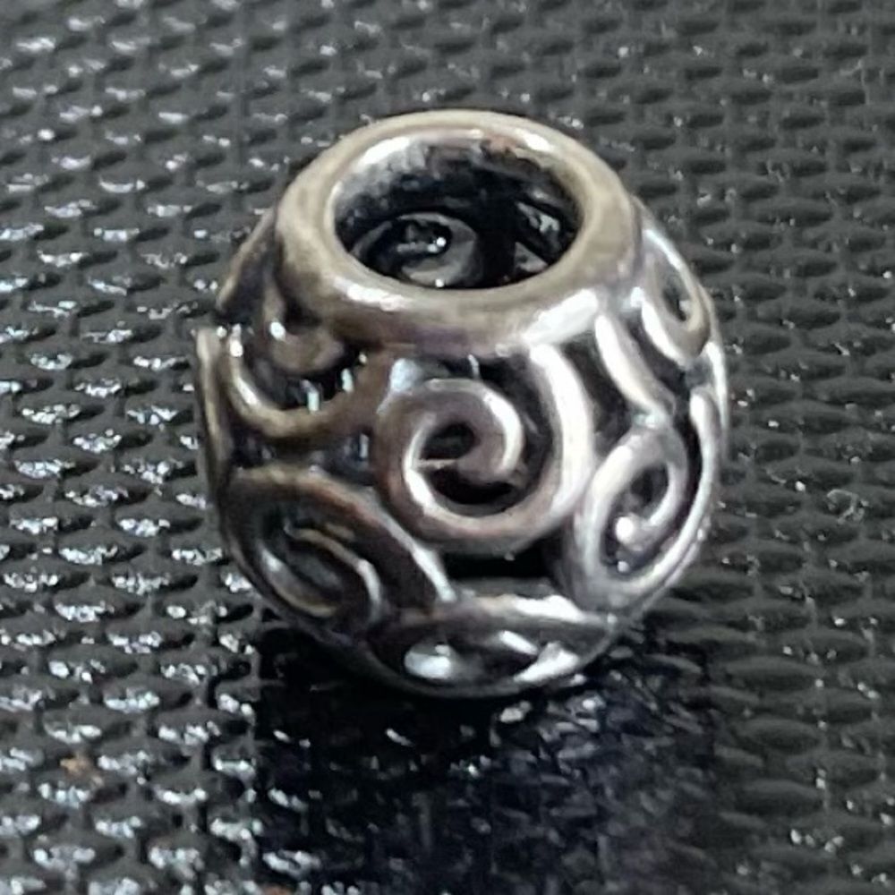 Sterling Silver Pandora Barrel with swirl design.